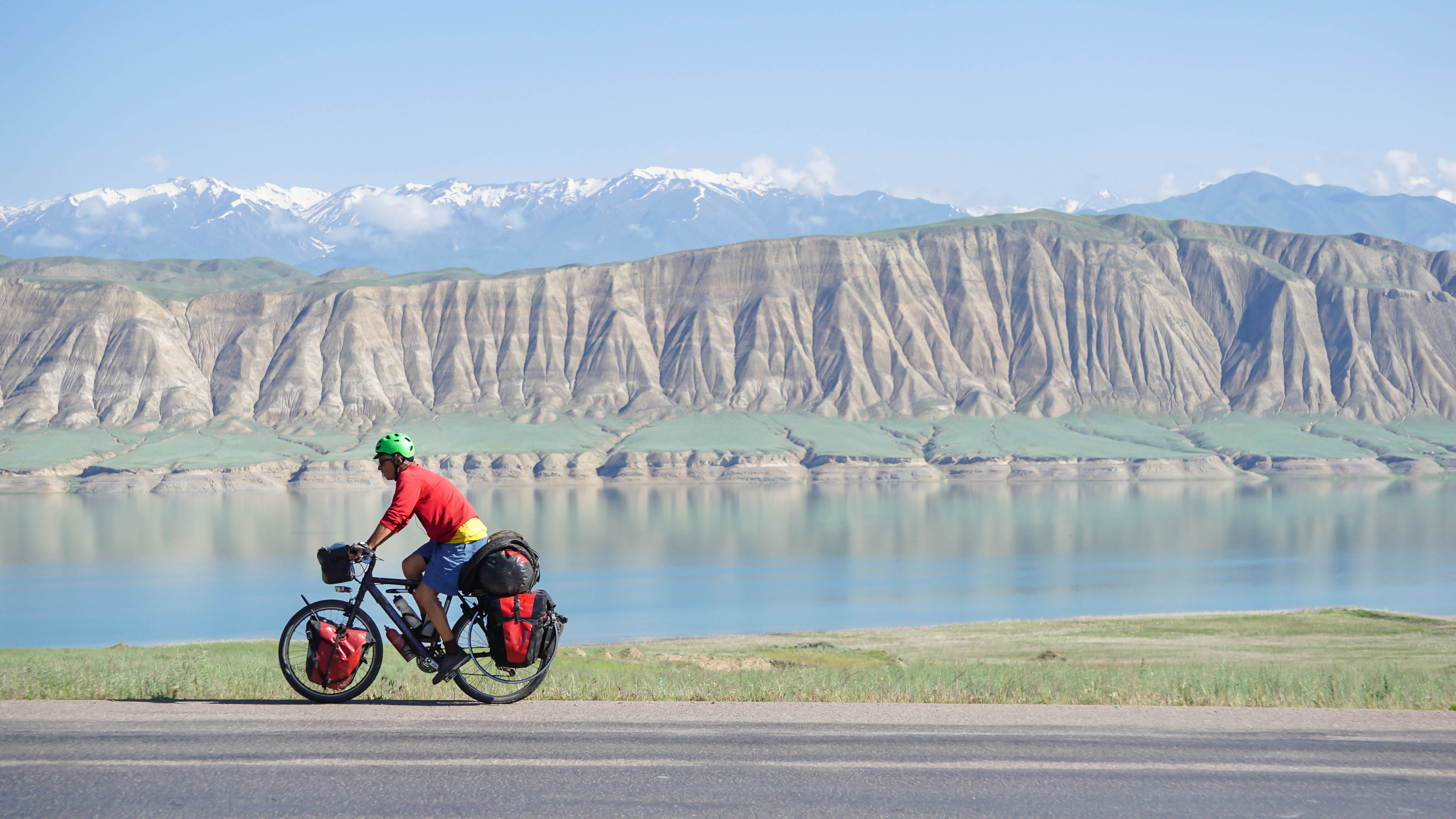 Pedaling past Lake Toktogul, Kyrgyzstan.