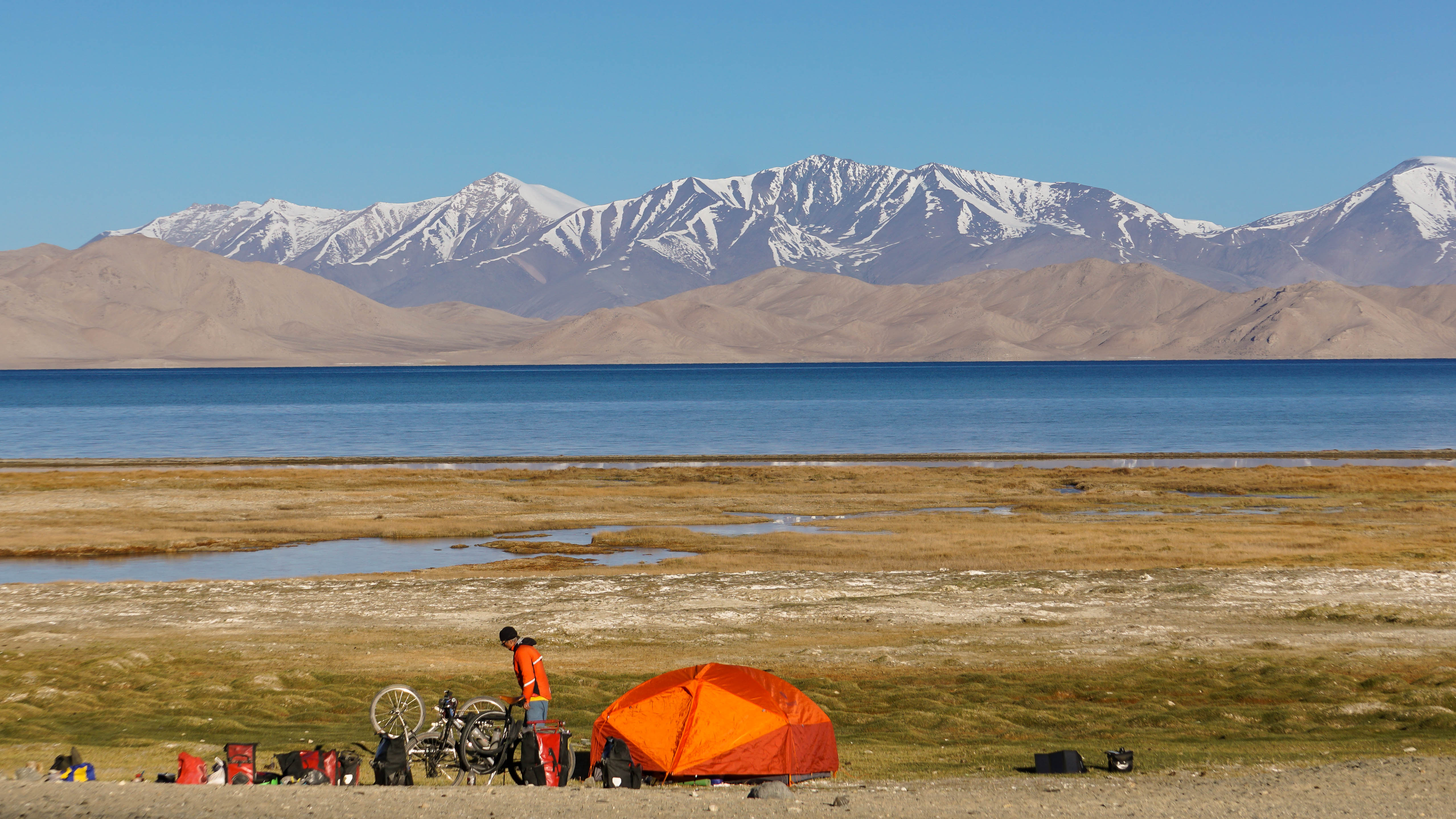 Camping on the shores of Lake Karakul, Tajikistan.